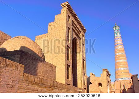 Traditional Architecture Inside Khiva Old Town With The Islam Khodja Minaret In The Background, Khiv