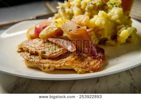 Roasted Pork Chops With Applecider Sauce Sliced Apple Red Onions And Smashed Potatoes