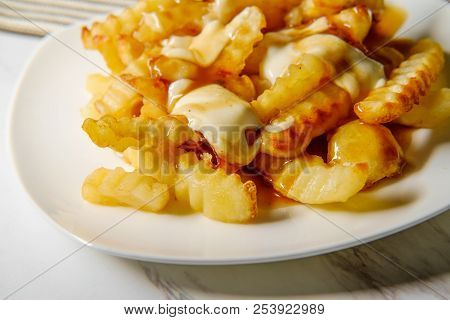 Canadian Poutine Crinkle-cut Fries With Gravy And Cheese Curd