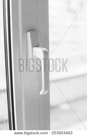 Close-up On A White Handle Of The Pvc Window.