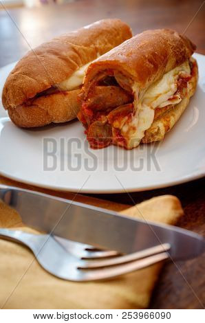 Sausage Parm Hero Sub Sandwich With Tomato Sauce Mozzarella Cheese Onions And Peppers