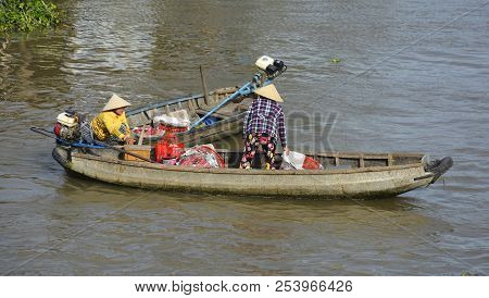 Phong Dien, Vietnam - December 31st 2017. Two Market Vendors In Their Boats At The Phong Dien Floati
