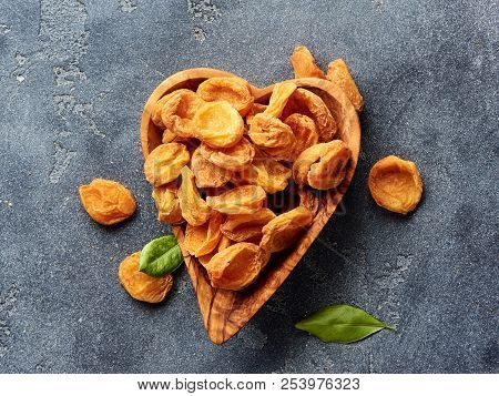 Dried Apricots On Gray Concrete Background. Top View.