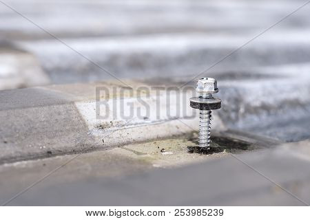 Gray Corrugated Metal Cladding On Industrial Building Roof