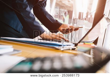 Close Up Asian Business Woman Using A Calculator To Calculate The Numbers.business Finances And Acco