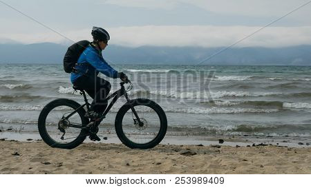 Fat Bike Also Called Fatbike Or Fat-tire Bike In Summer Driving On The Beach.