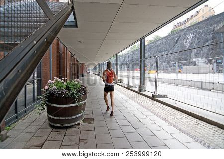 Stockholm, Sweden - July 11, 2018: Female Jogger At Stadsgardskajen On July 11, 2018 In Stockholm, S