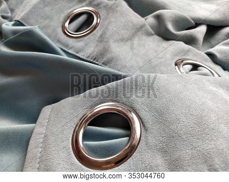 Two Metal Eyelets On Gray-blue Velvet Curtains