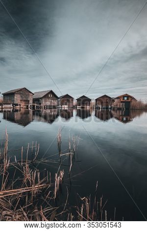 Neusiedler See, Lake Neusiedl. Bay With Wooden Pier And Wooden Cottage.