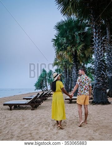 Najomtien Pattaya Thailand, Couple Men And Woman Walking On The Beach During Sunrise In Pattaya Thai