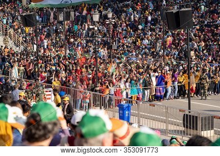 Amritsar, India - Febuary 8, 2020: Indian Women Dance In The Parade At The Wagah Attari Border Closi