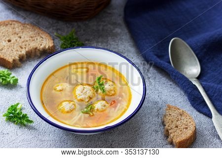 Dietary Soup With Meatballs, Potatoes And Noodles Served With Rye Bread With Bran. Childrens Menu.
