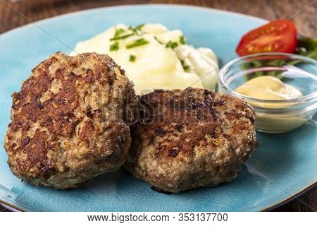 Two Bavarian Meat Loafs On A Plate