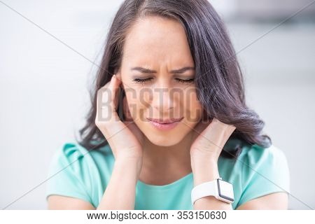Young Woman Have Headache Migraine Stress Or Tinnitus - Noise Whistling In Her Ears