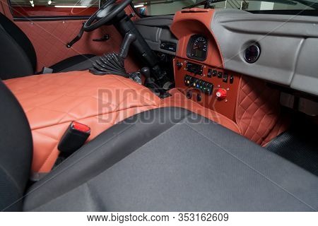 Novosibirsk, Russia - 02.26.2020: Red Interior Of Used Uaz Van 452 469 Car With Dashboard, Steering 