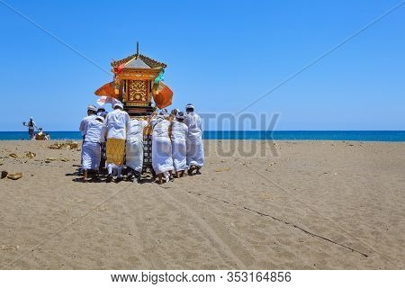 Bali Island, Indonesia - March 18, 2015: Balinese People Procession Walking By Beach With Hindu Scar