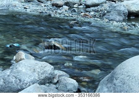 Beautiful View Of A River Flowing With Full Swing