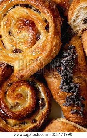 Variety Of Traditional French Puff Pastry Buns With Rasin And Chocolate, Croissant Over White Textur