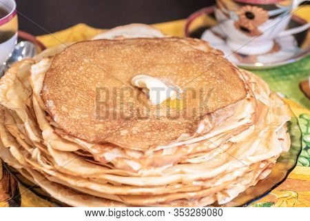 On The Table, Tea With Pancakes, Sour Cream And Jam For The Maslenitsa Holiday, Which Is Celebrated 