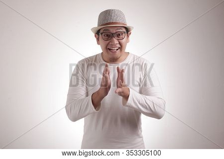 Young Asian Man Wearing White Shirt, Happy Proud Clapping Gesture.over Grey Background, Halfl Body P