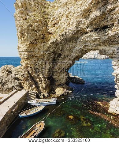 Berth At Cape Big Atlesh. Fishing Boats On The Clear Emerald Water Of The Black Sea. Crimea, Tarkhan