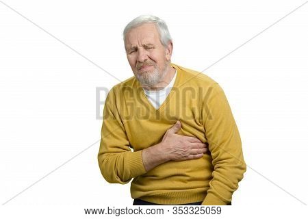 Old Man Having Heart Attack. Portrait Of Senior Man Touching His Breast, Feeling Pain. White Isolate