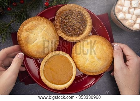 Holiday Table Set With Various Flavors Of Fresh Baked Pies
