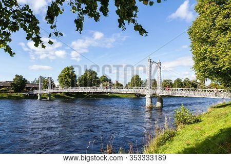 Scotland  - September 07 2019: Blue Skies And Green Foliage With The Historic Infirmary Bridge Cross
