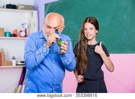 School Education. Biological Sample. Mature Teacher Look Through Magnifying Glass Tube On Lime. Smal