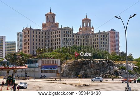 Havana, Cuba - May 08, 2019: Cuba Word Sign With Red Triangle And A Star Over Hotel Nacional, With C