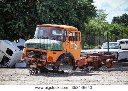 Rundu, Namibia - February 8, 2020: Remains Of The Orange Truck Mercedes-benz L At The Roadside.