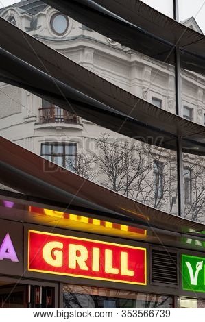 Vienna, Austria - 02/29/2020: Reflection Of An Old House On A Modern Building In Wien Landstrasse, R