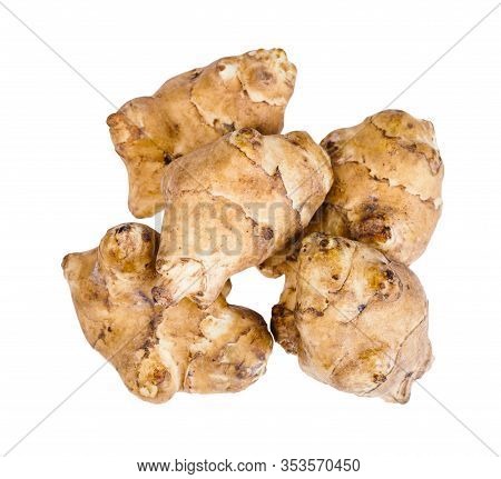 Top View Of Pile From Several Raw Tubers Of Jerusalem Artichoke (sunroot) Isolated On White Backgrou