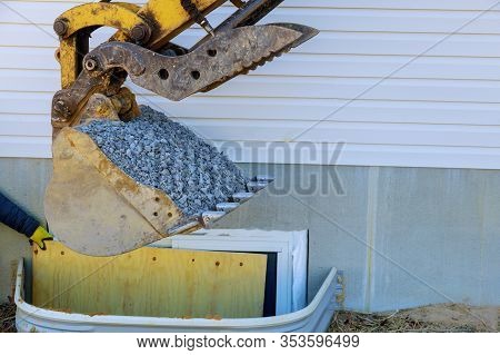 Moving Gravel Scoop Building Materials Window Well For Basement Construction New Residential Home