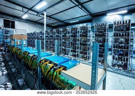 Bitcoin and crypto mining farm. Big data center. High tech server computers at work