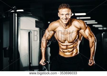 Bodybuilder Pumping Up Chest Muscles Push-ups Bars