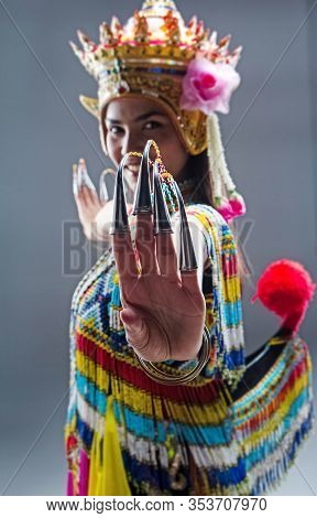 The Beautiful Woman Wearing Thai Southern Folk Dancing Costume,made From Colorful Bead,showing How T