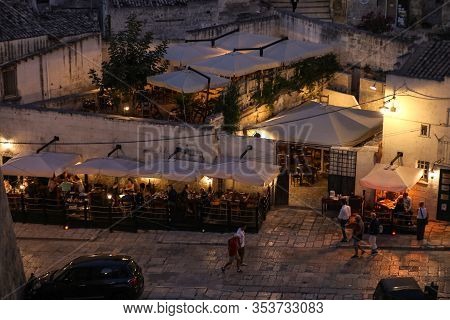 Matera, Italy - September 14, 2019: Evening View Of The City Of Matera, Italy, With The Colorful Lig