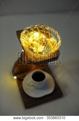 Creative Art Handmade Lamp Made Of Drip Coffee Station, V60 Dripper And Lights. Cup Of Black Coffee 