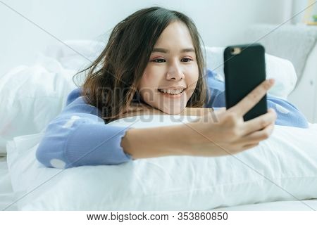 Happy Asian Pretty Woman In Casual Clothing Smiling Take Selfie And Video Call On Mobile Phone And L