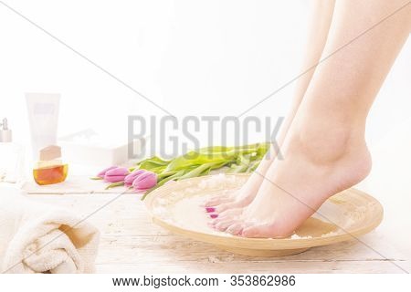 A Young Woman Taking Warm Footbath With Special Salts. Home Spa. Womans Day.