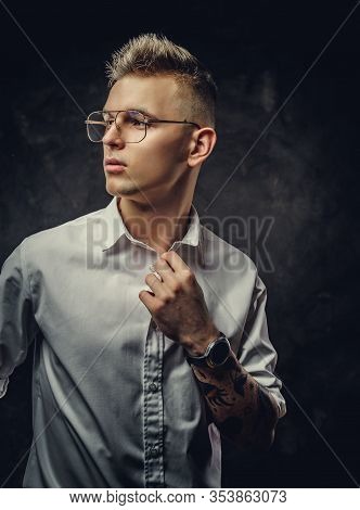 Young Handsome Student Guy In A White Shirt And Glasses, With Tattoos On His Hand, Wearing His Watch