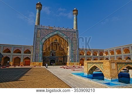 Isfahan, Iran - May 8, 2015: Visitors At The Inner Courtyard At The Jameh Mosque South Iwan.