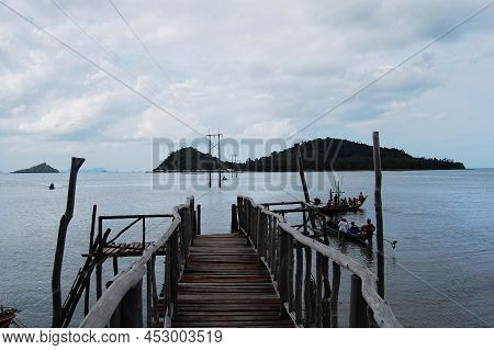 View Landscape Wooden Bridge And Boat Pier Go To Koh Pitak Or Ko Phithak Island In Gulf Of Thailand 
