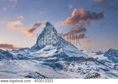 Scenic View Of Beautiful Matterhorn Mountain In Alps Against Sky During Sunset