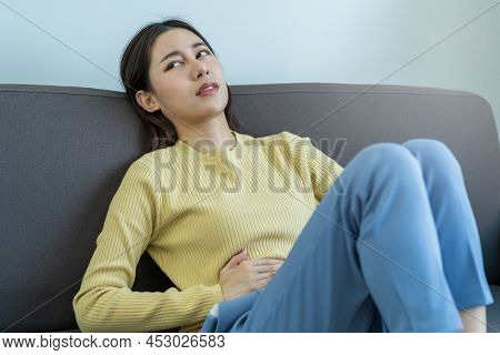 Flatulence Asian Young Woman, Girl Lying, Sitting In Stomach Ache, Suffer From Food Poisoning, Abdom