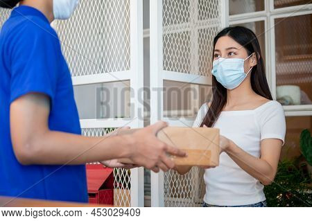 Asian Young Woman, Client Received A Delivery Of Cardboard Box, Parcel From Delivery, Postman, Weari