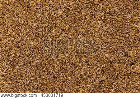 Dry Rolls Dill - Anethum Graveolens - Seeds On Flat Surface, Flat Texture And Full-frame Background.