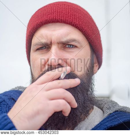 Cigarette Nicotine Addiction. Hipster Brutal Man Smoking Cigarette. Smoking Addiction. Smoker Gyu.