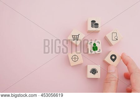 Senior Businessman's Hand Hold Check In Icon On Wooden Cube Block People Inside Crop In Middle For B